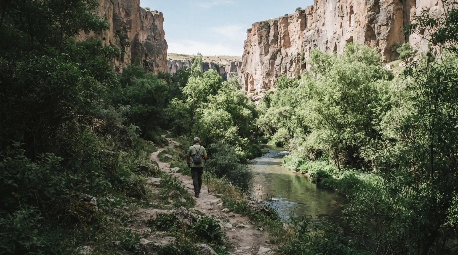 The Melendiz river running green between tree-lined cliffs in the Ihlara Valley, Cappadocia