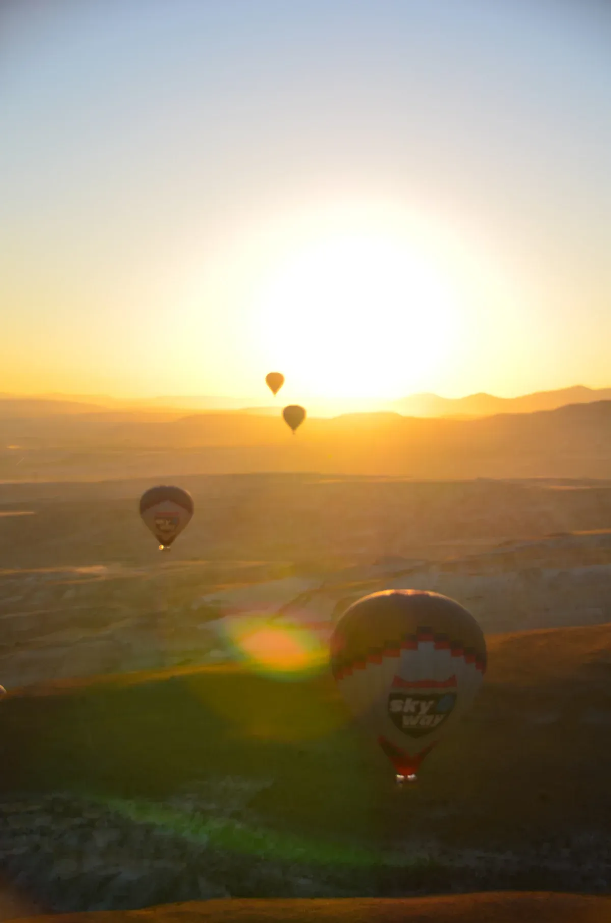 Balloons at dawn over the valleys, Göreme city guide, Cappadocia
