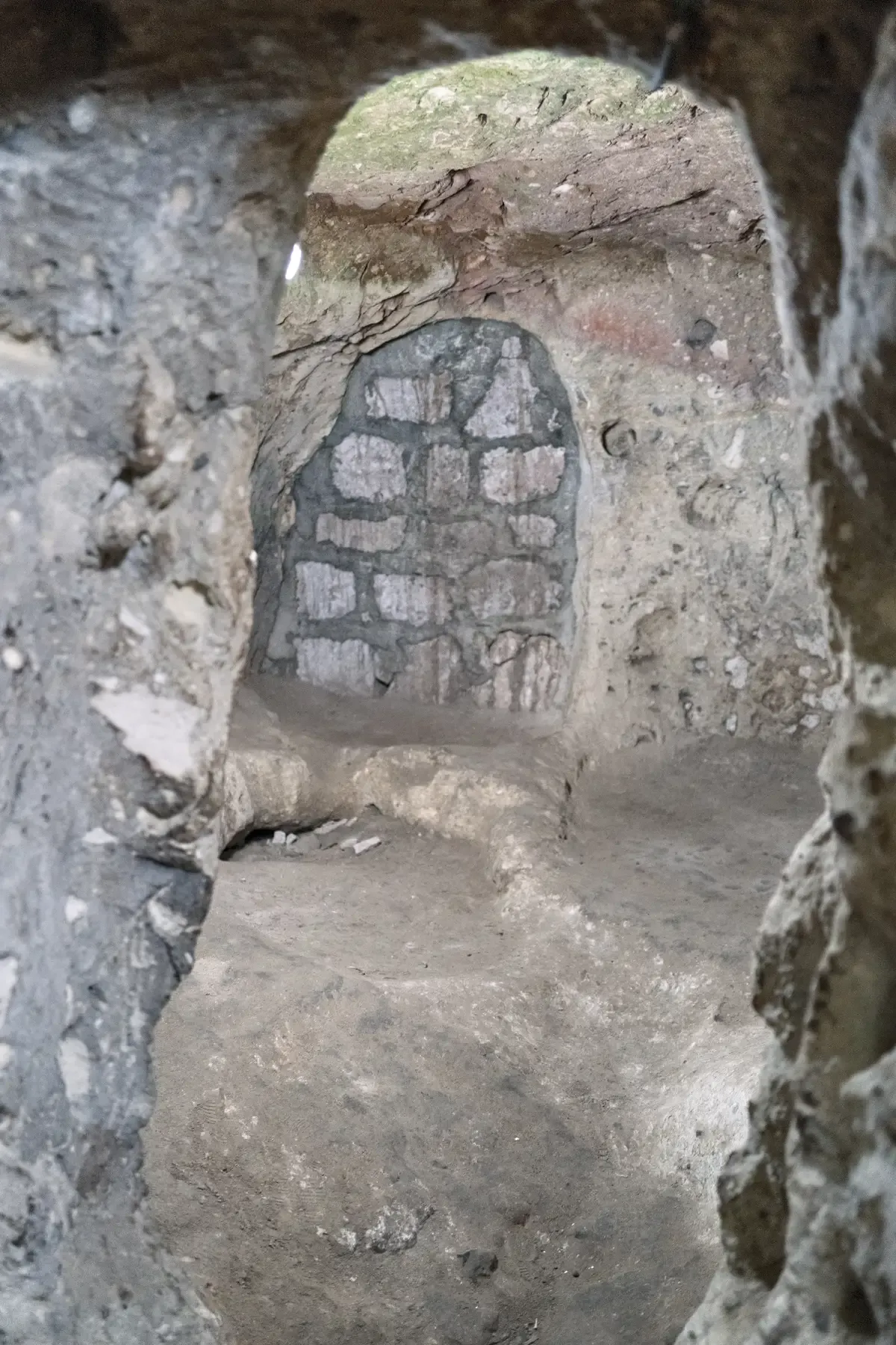 A wide chamber with arched openings carved into tuff inside Derinkuyu underground city