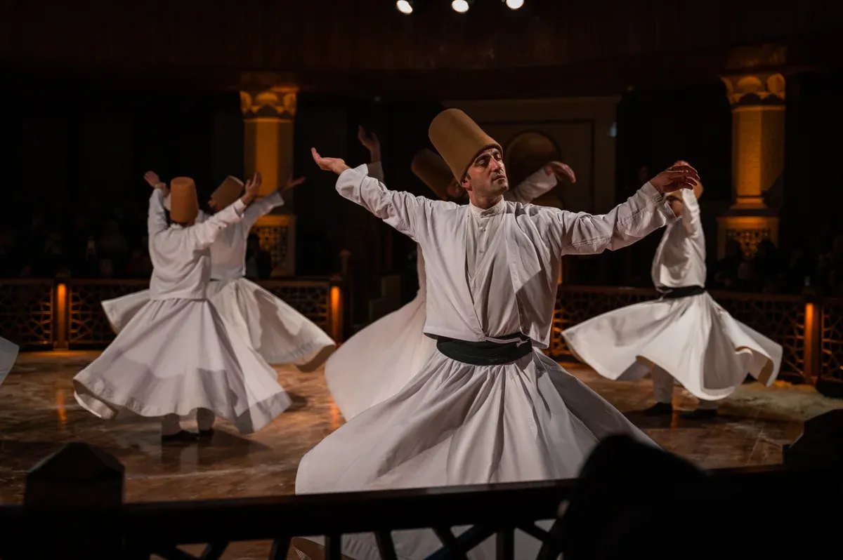 Whirling dervishes in white robes during a sema ceremony in Cappadocia