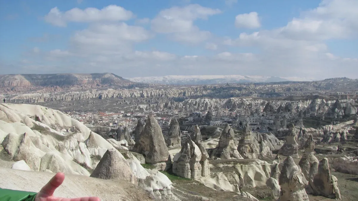 The fairy-chimney skyline rising directly behind the streets of Göreme.